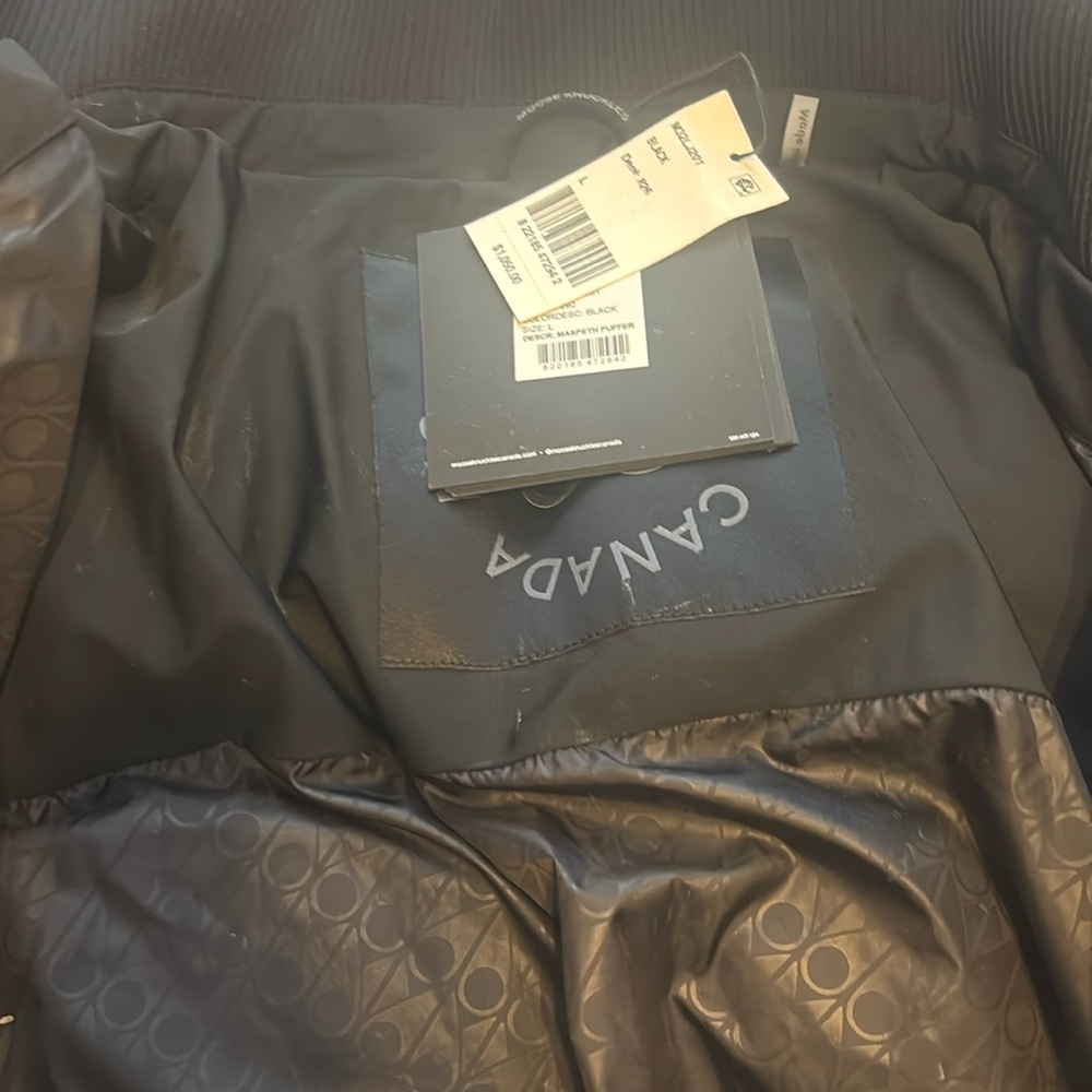 Moose knuckles woman puffer jacket black . Never worn size L